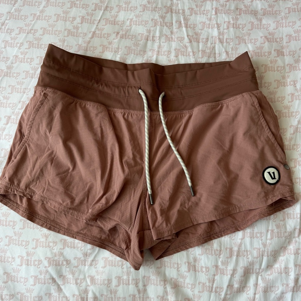 Vuori pink running shorts